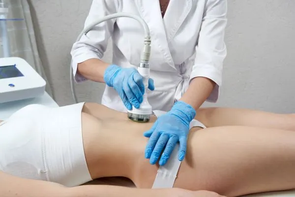 Lost the Weight but Not the Loose Skin? 2 woman having HIFU treatment on her stomach to combat loose skin Rochdale following weight loss